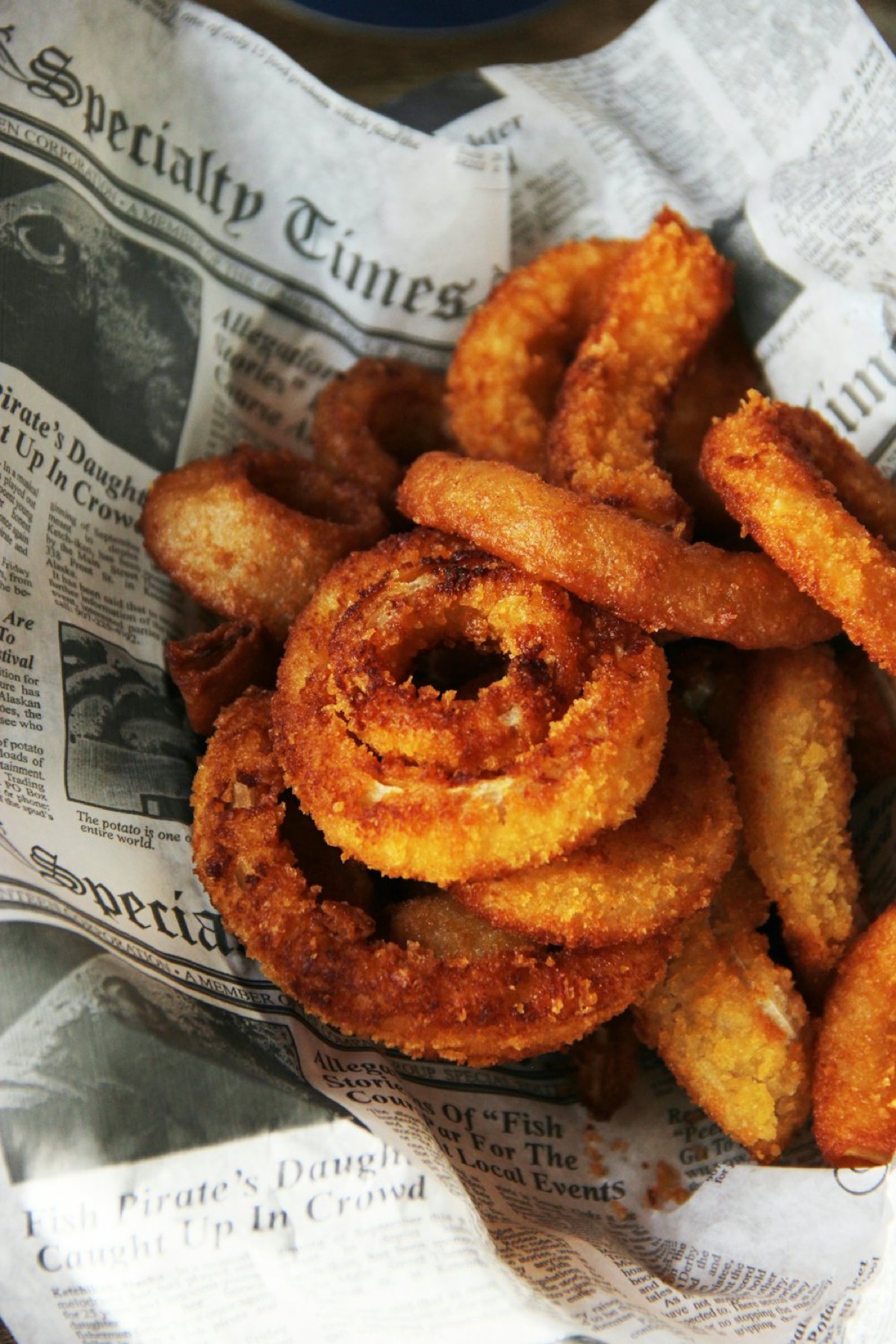 Crispy air-fried onion rings in a basket