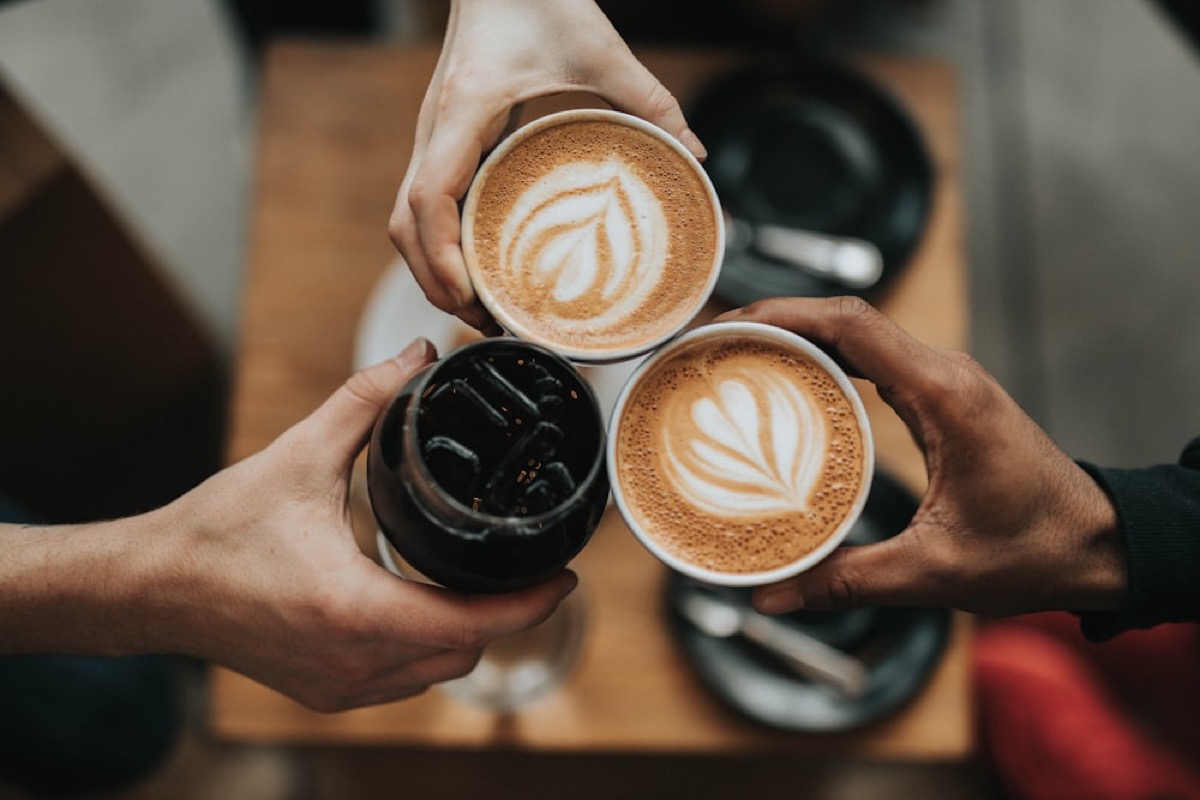 Three cappuccinos with latte art