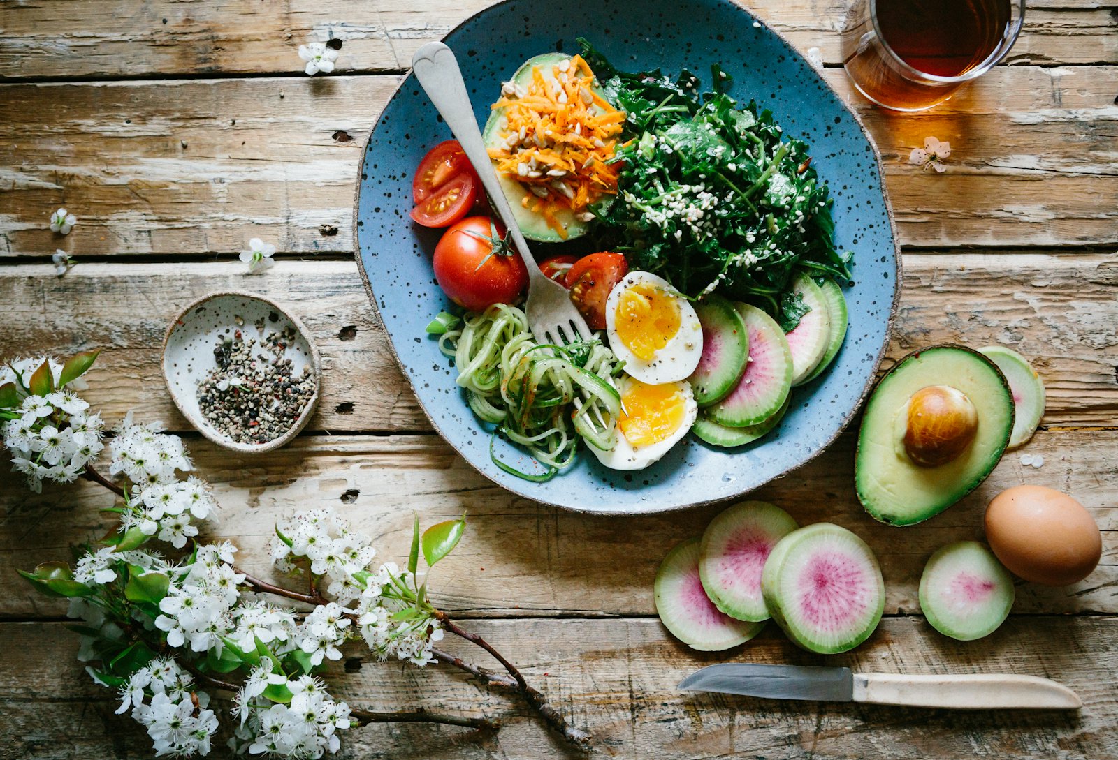 A rustic bowl of fresh food on a wooden table