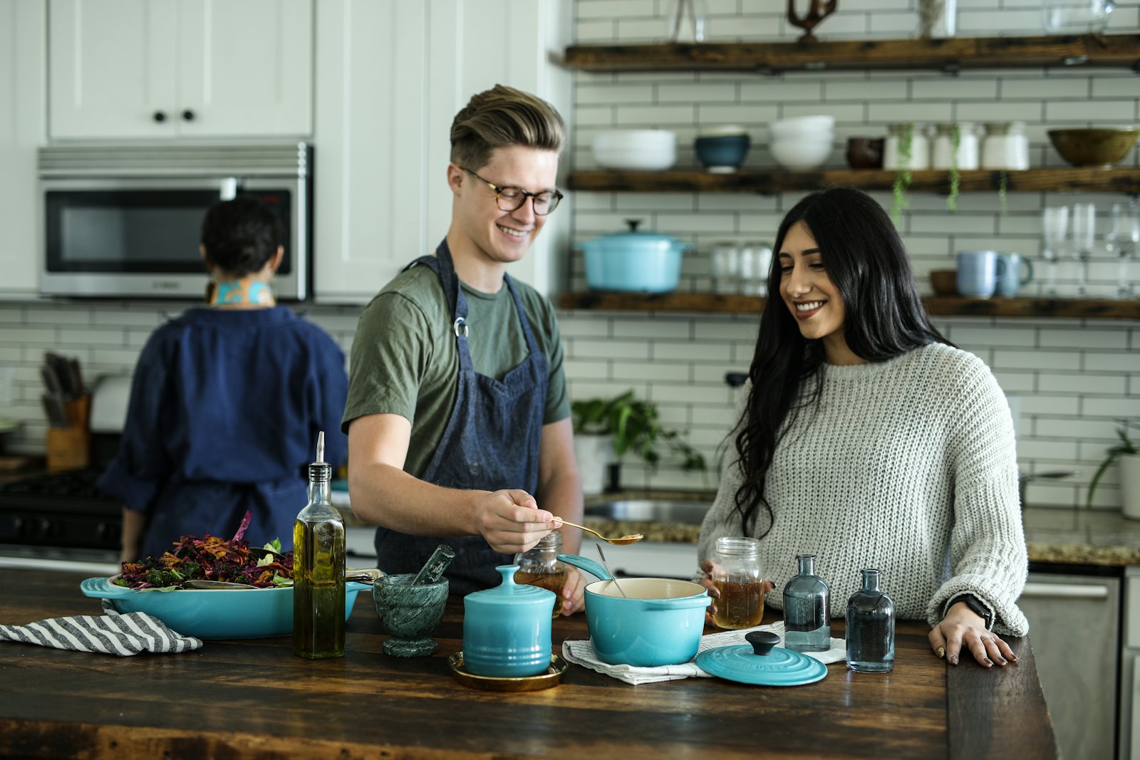 People cooking together in a warm kitchen