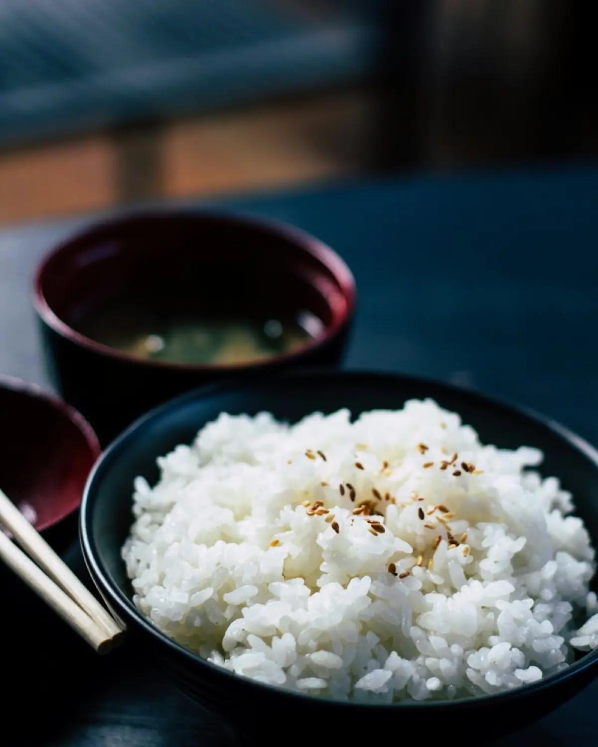 A bowl of steamed white rice with miso soup