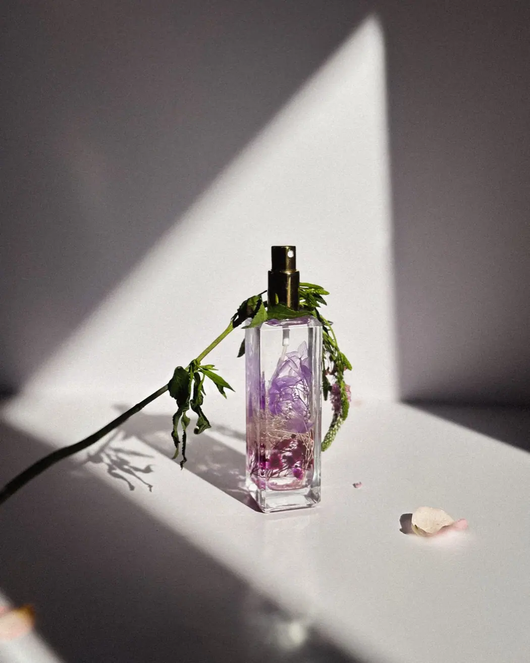 An elegant women's luxury perfume bottle with flowers