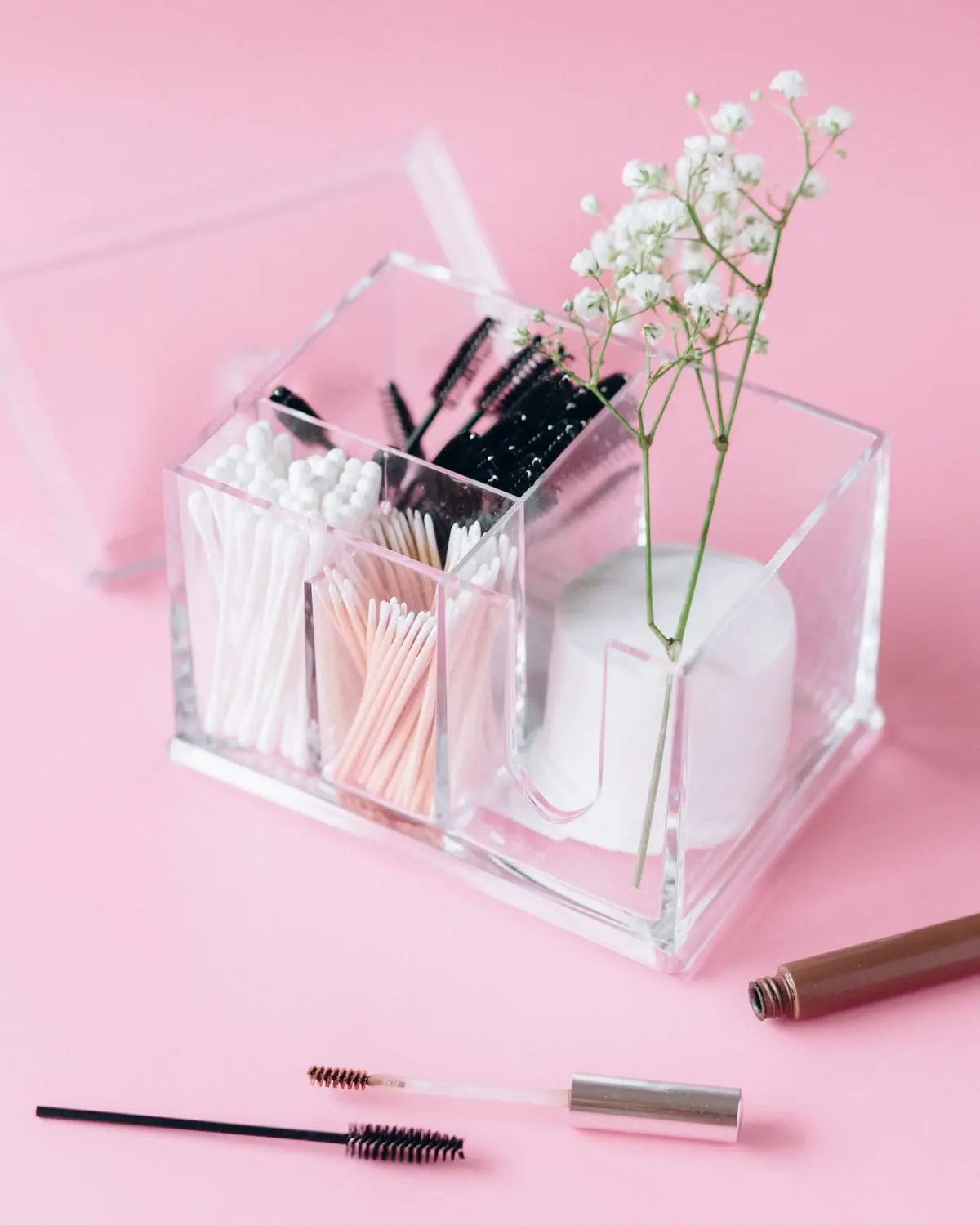 A makeup organizer holding brushes and cosmetics