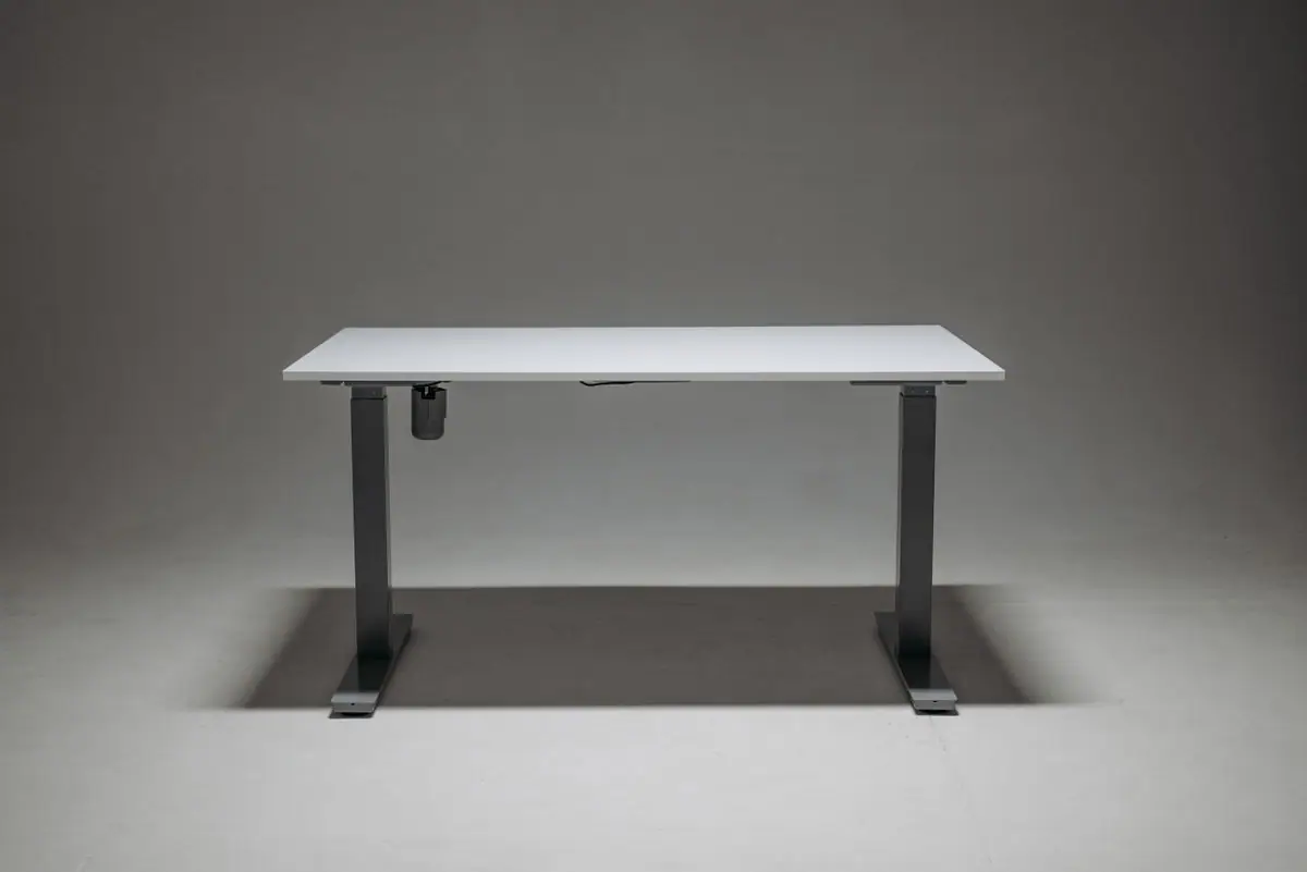 A white height-adjustable standing desk
