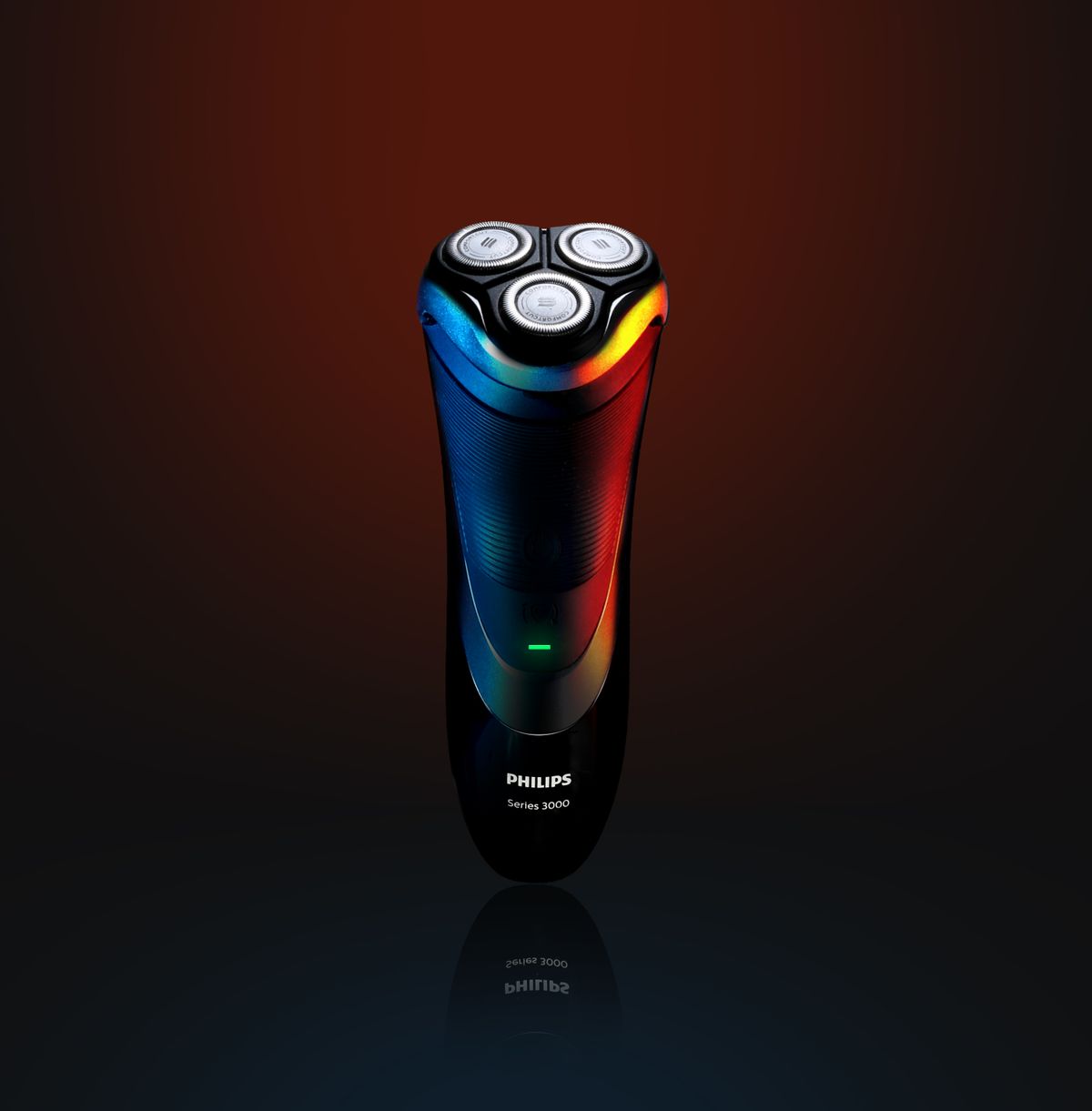 A black and blue electric shaver