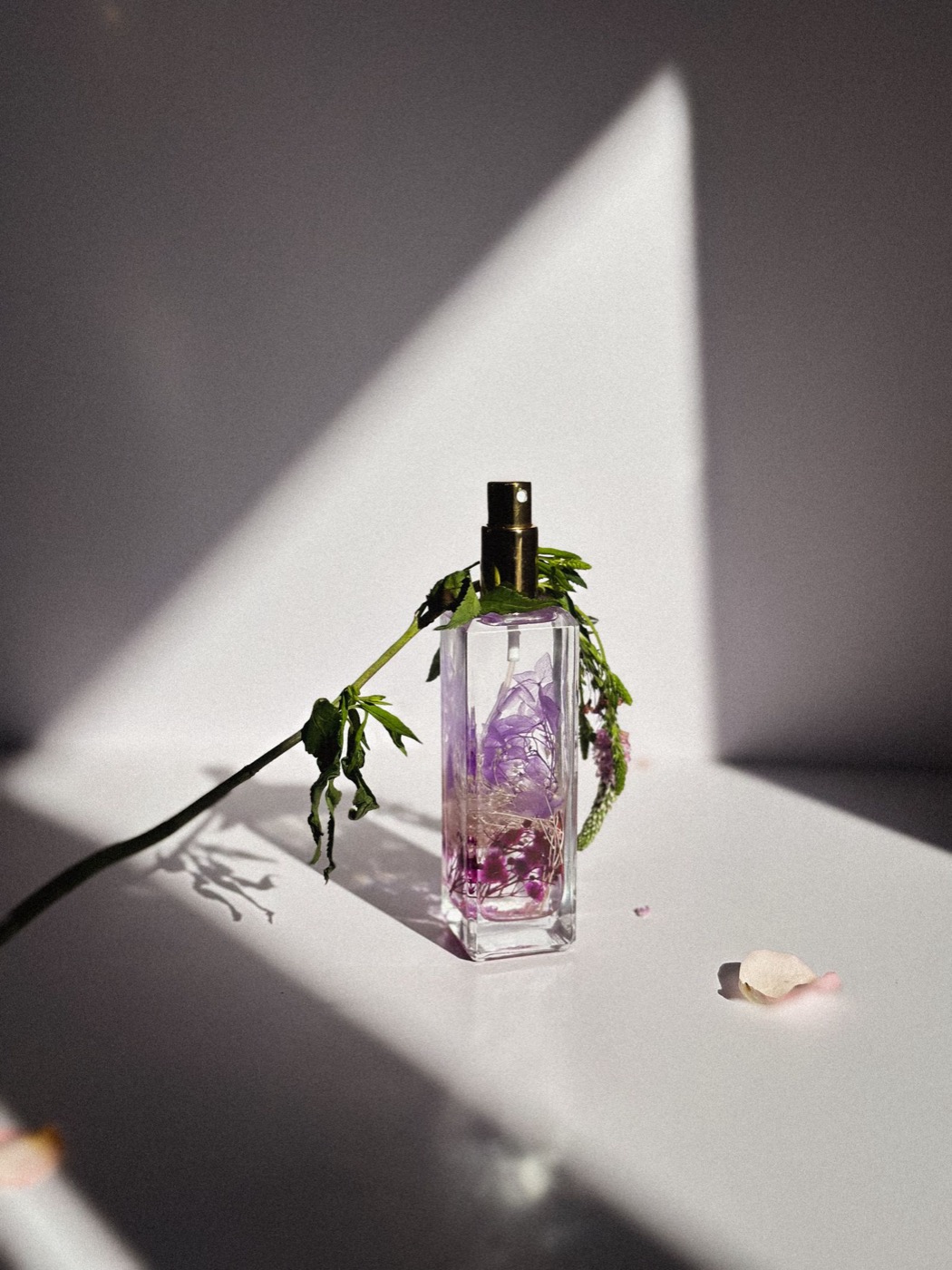 An elegant women's luxury perfume bottle with flowers