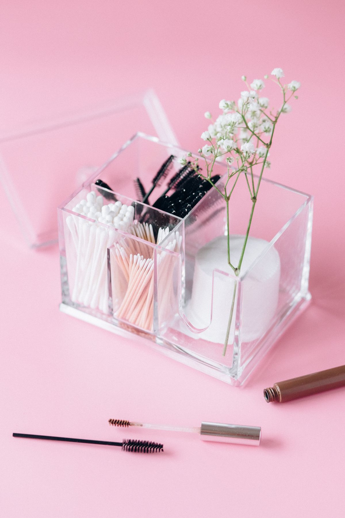 A makeup organizer holding brushes and cosmetics