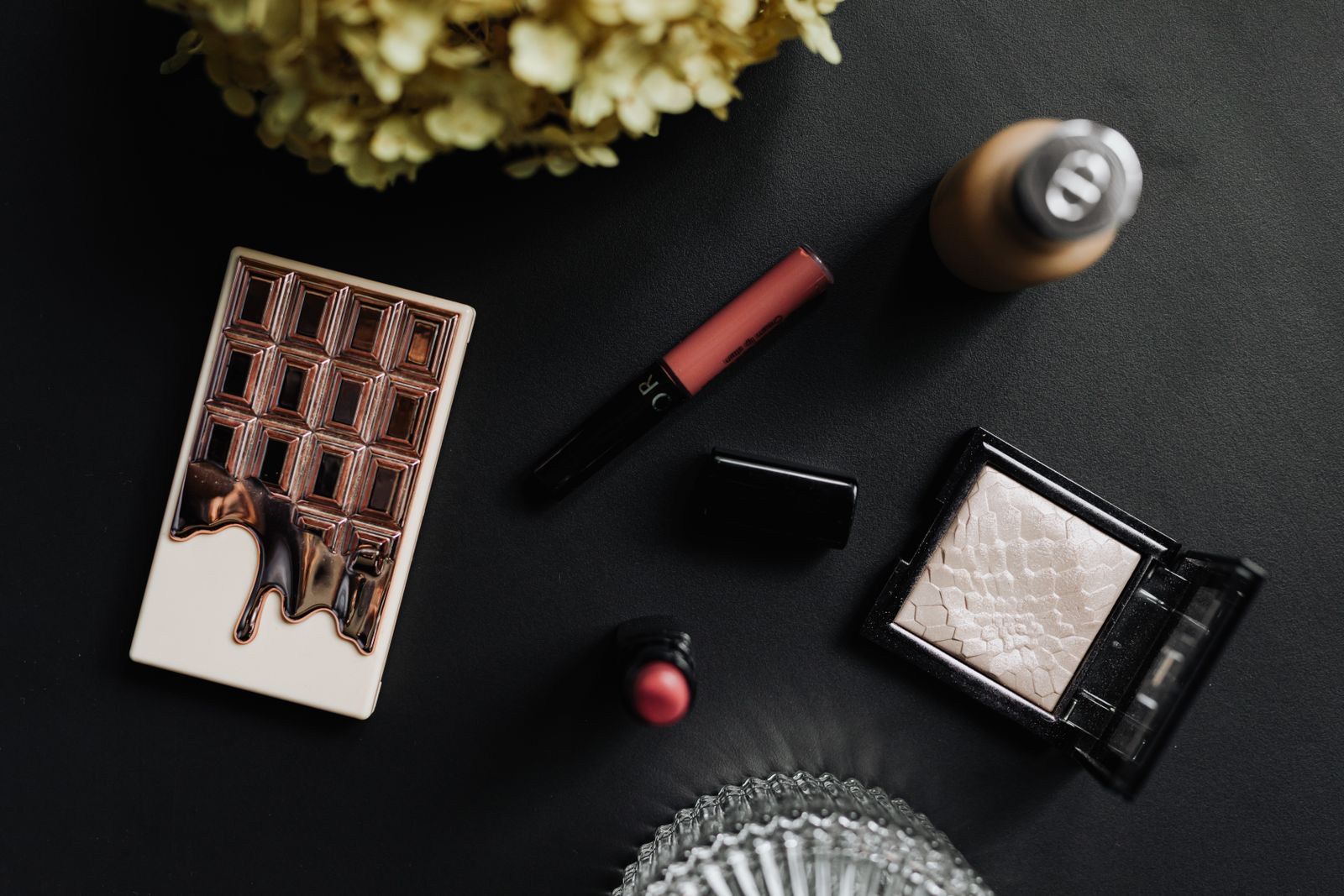 An assortment of makeup and cosmetics on a table